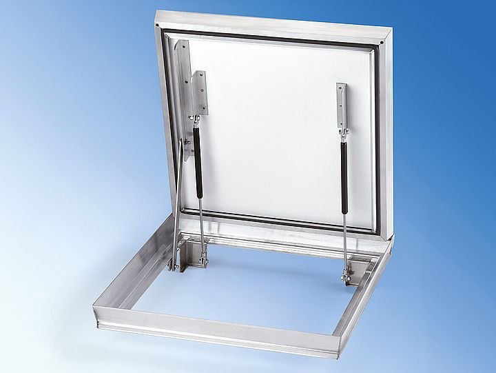 Tapa estanca pavimentable de aluminio abisagrada con apertura asistida